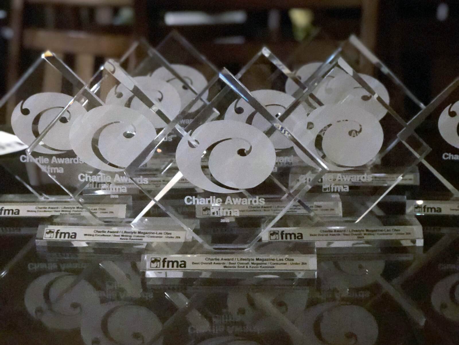 12 FMA Awards for Lifestyle Magazines placed on a table