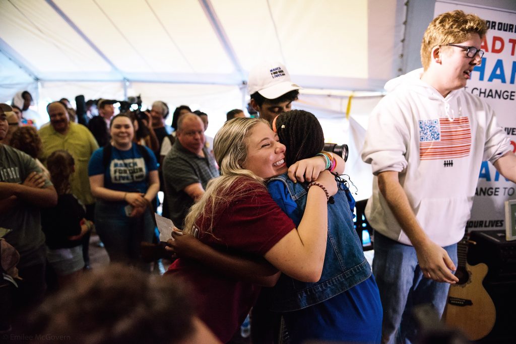 Corin shares an emotional embrace during a Road to Change event in Newtown, Connecticut—where the Sandy Hook shooting took place in 2012.