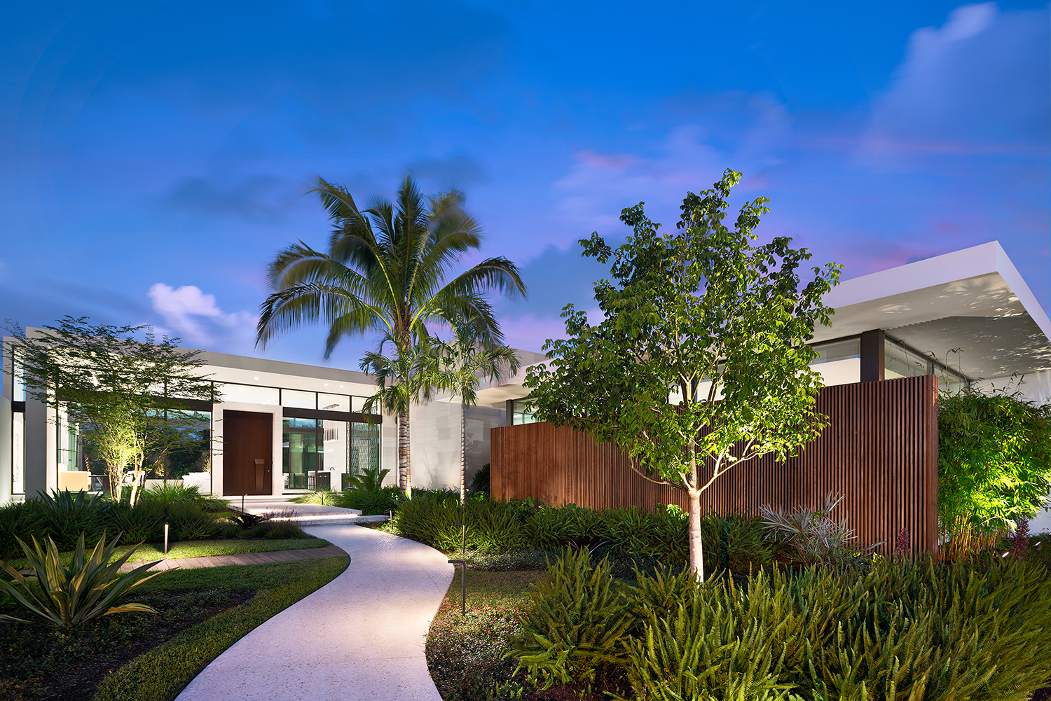 Rich landscaping adds to the overall splendor of the one-story Weston estate.